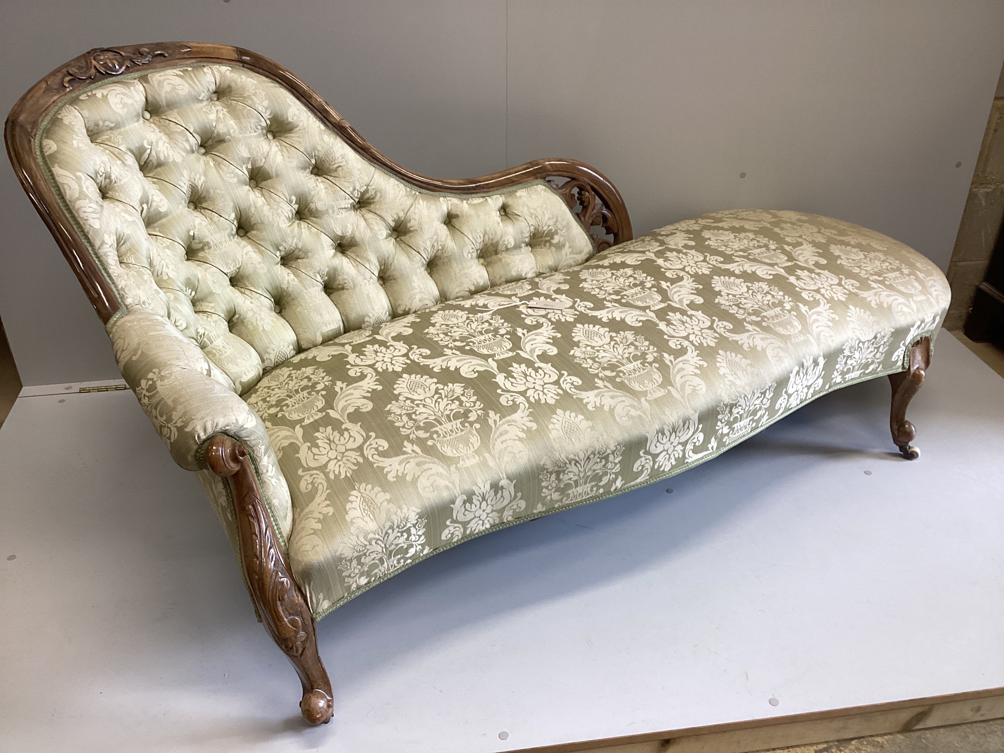 A Victorian walnut chaise longue with deep buttoned back, width 170cm, depth 75cm, height 87cm